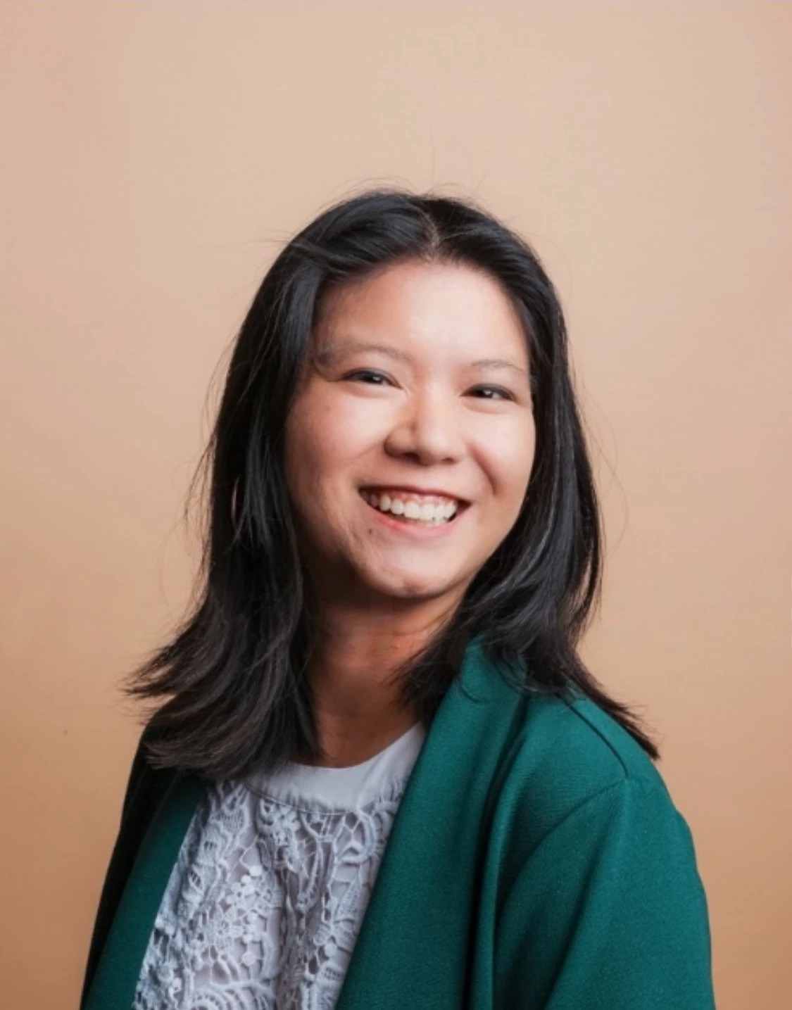 Hanh, the founder and date concierge behind the service, smiling warmly